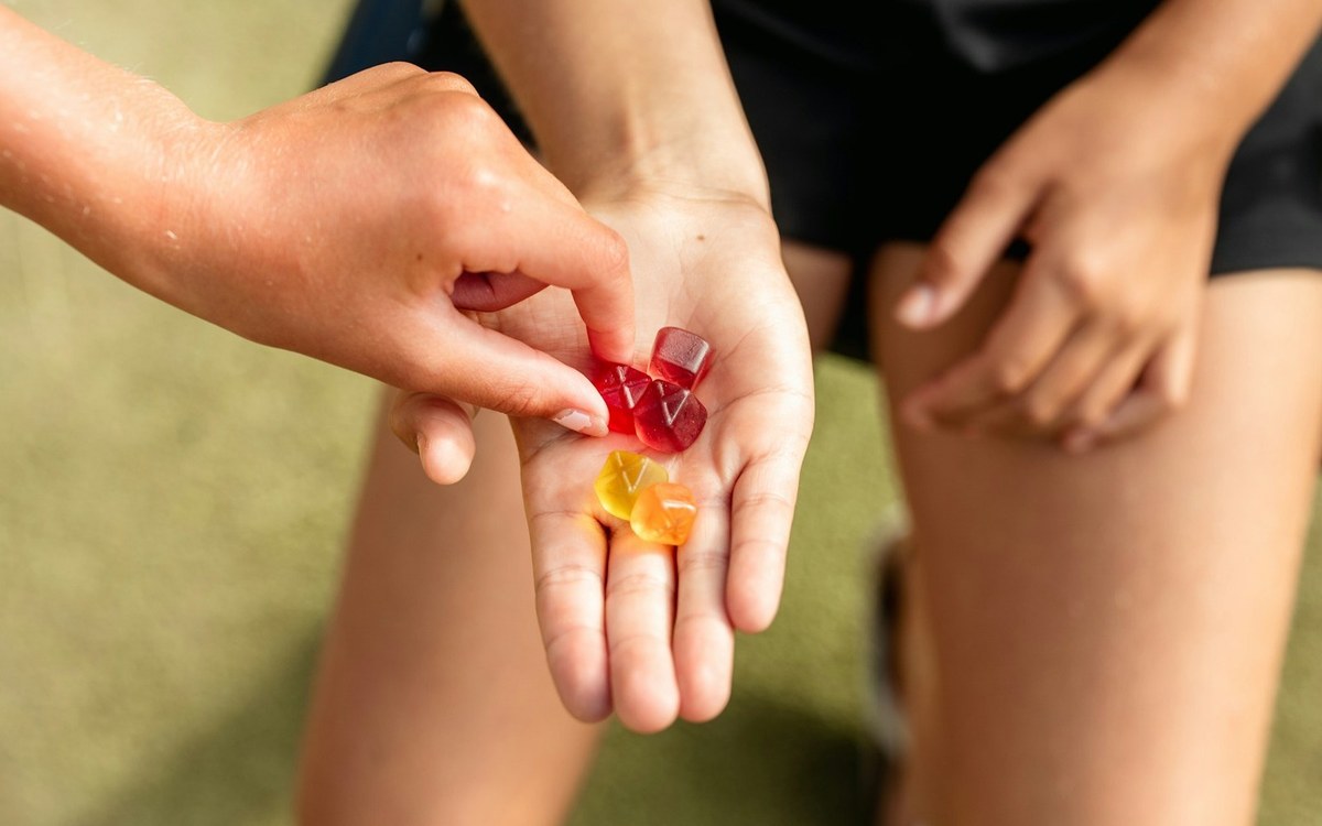 Hand holding Delta-9 THC gummies